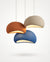 Sculptural Maison Moya pendant lamp casting warm light