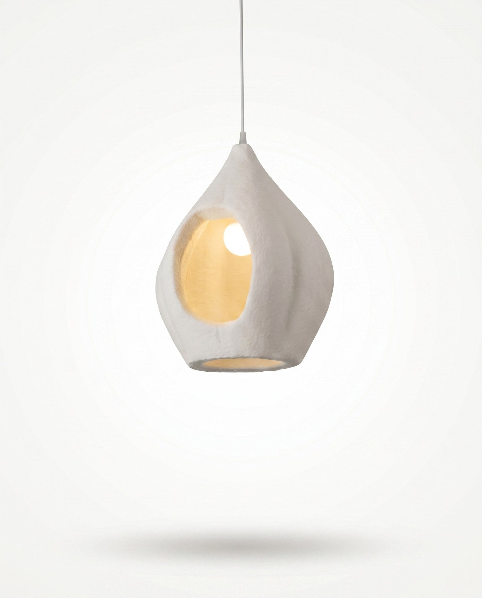 Linear pendant centred over a dining table